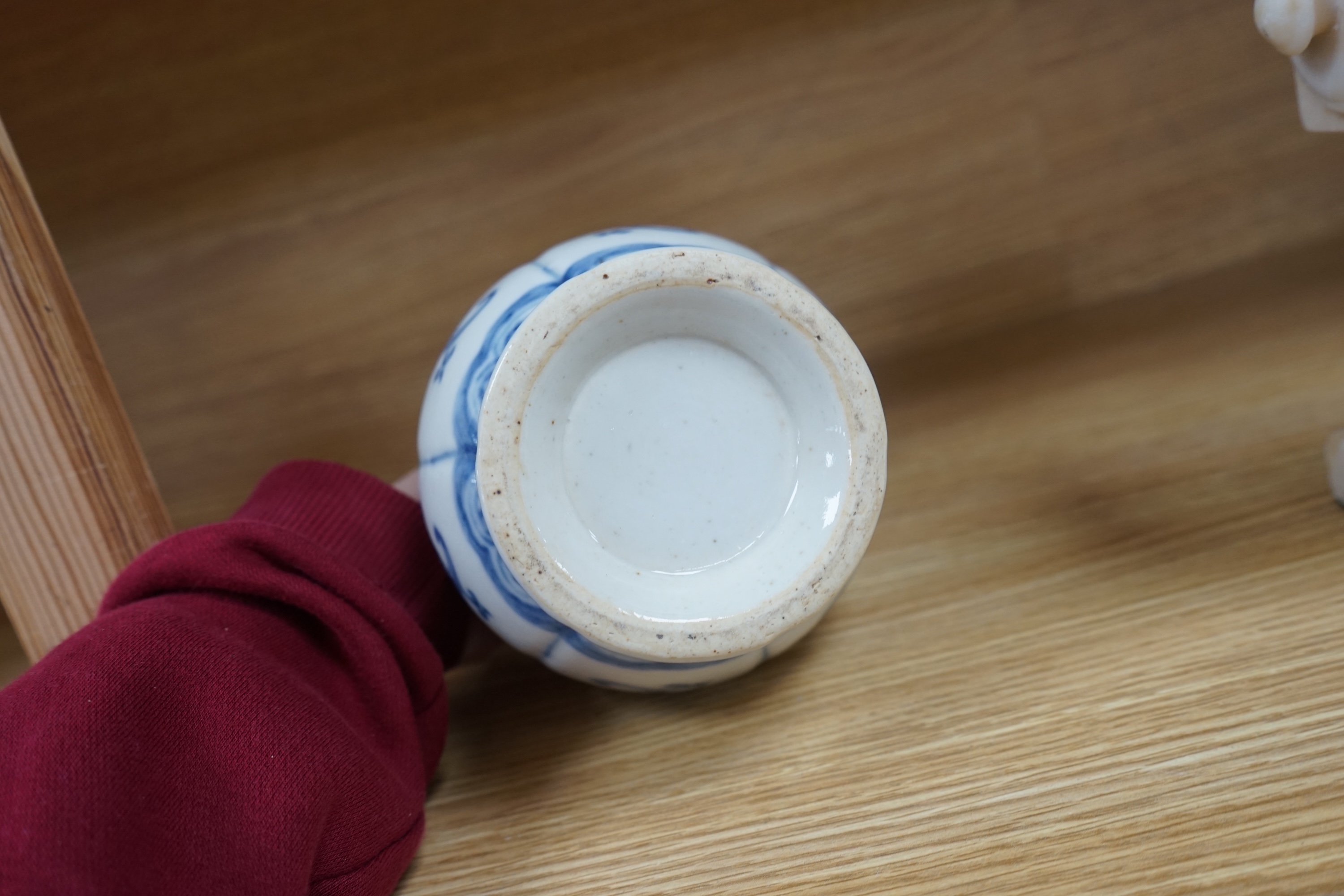 A Chinese blue and white bulbous vase 18cm high. Condition - good.